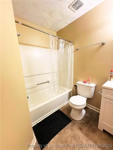 a bathroom with a toilet a sink and a bathtub