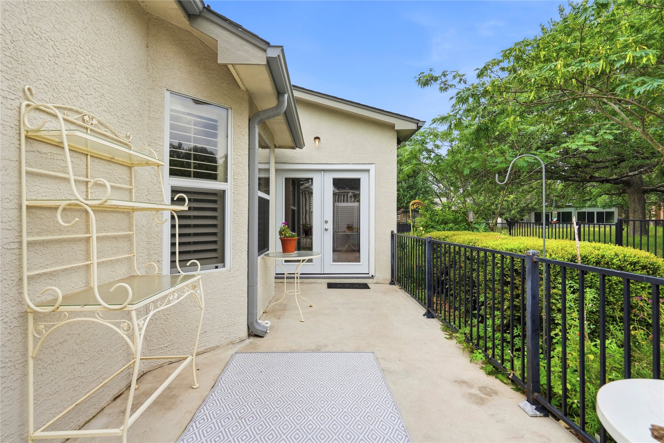 117 Whitewing Way Georgetown, TX 78633 - Photo 21 of 27 A quiet patio with French doors offers serene outdoor relaxation.