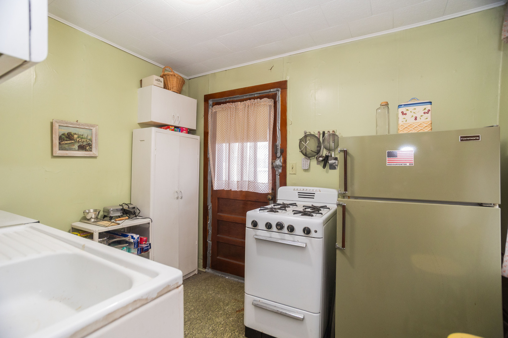 4155 West Grace Street Chicago, IL 60641 - Photo 13 of 30 a bathroom with a sink and a refrigerator