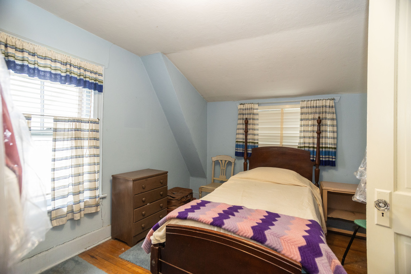 4155 West Grace Street Chicago, IL 60641 - Photo 23 of 30 a bedroom with a bed and wooden floor