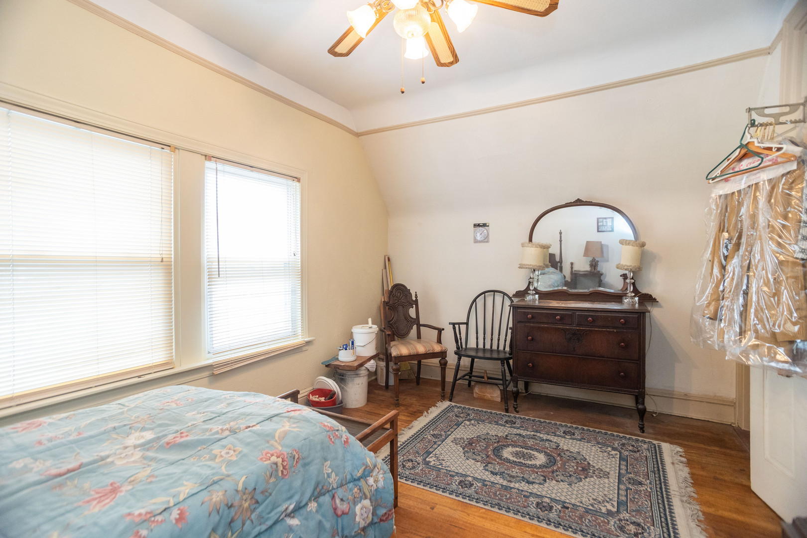 4155 West Grace Street Chicago, IL 60641 - Photo 26 of 30 a bed room with a bed and a chandelier
