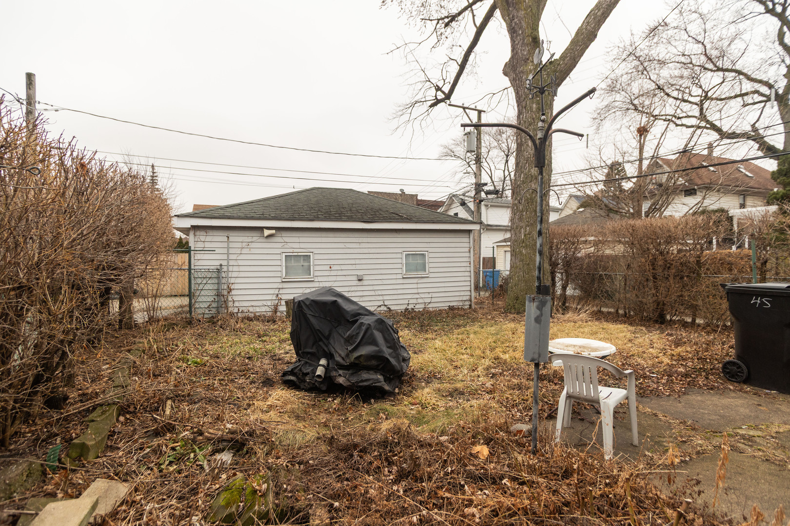4155 West Grace Street Chicago, IL 60641 - Photo 4 of 30 a view of a backyard with table and chairs and a fire pit