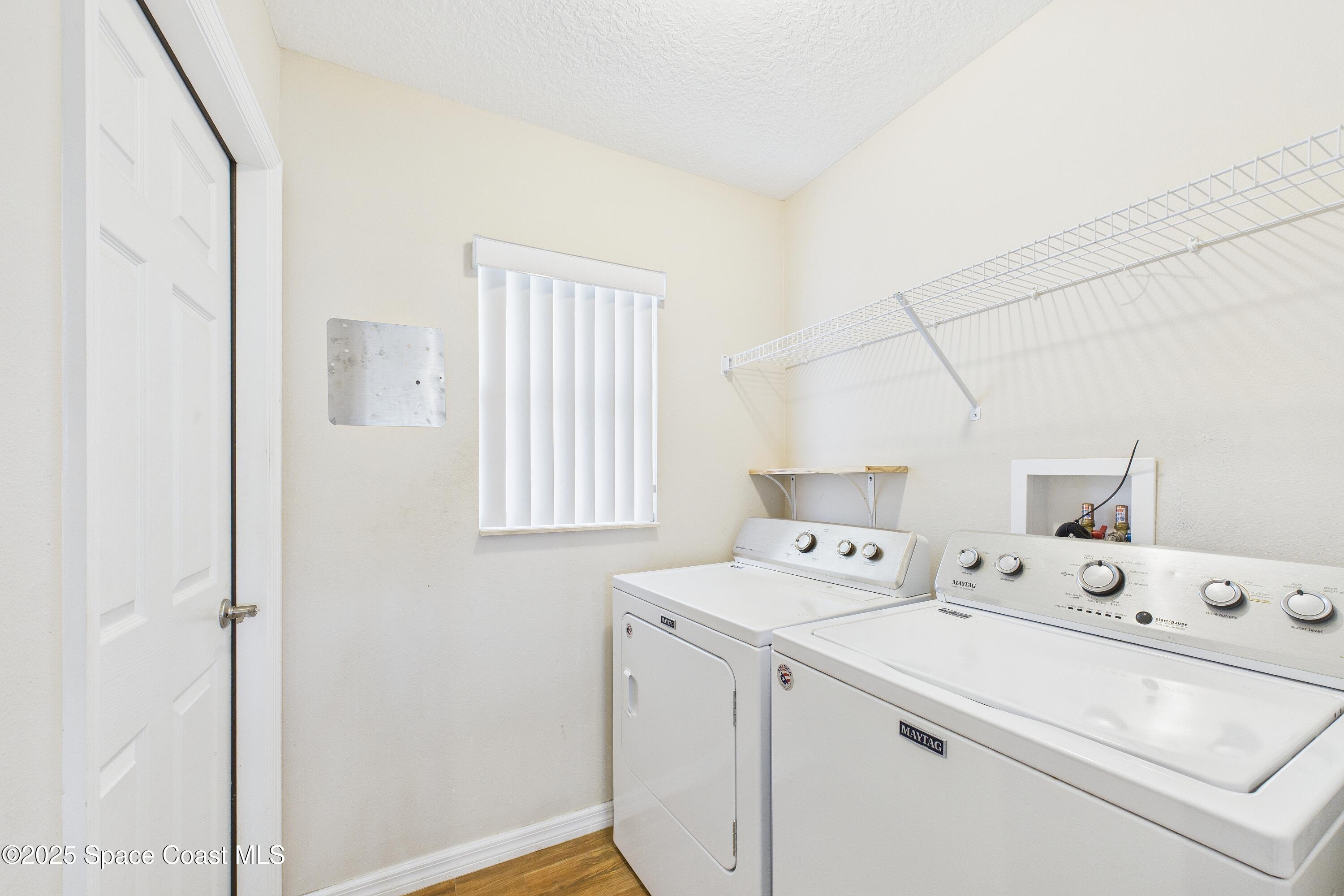 1936 Gloria Circle Palm Bay, FL 32905 - Photo 16 of 50 a utility room with dryer and washer