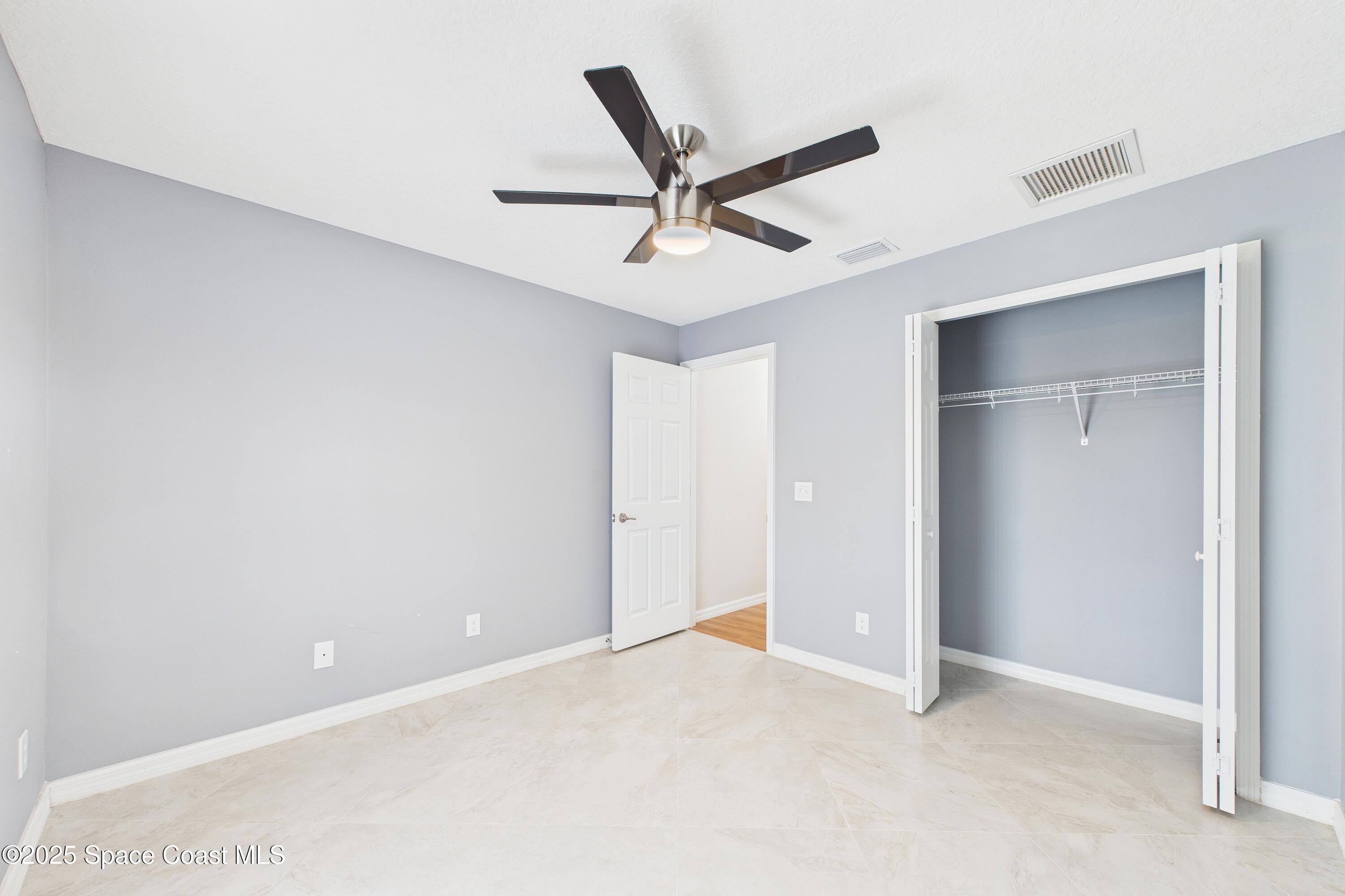 1936 Gloria Circle Palm Bay, FL 32905 - Photo 21 of 50 a view of an empty room