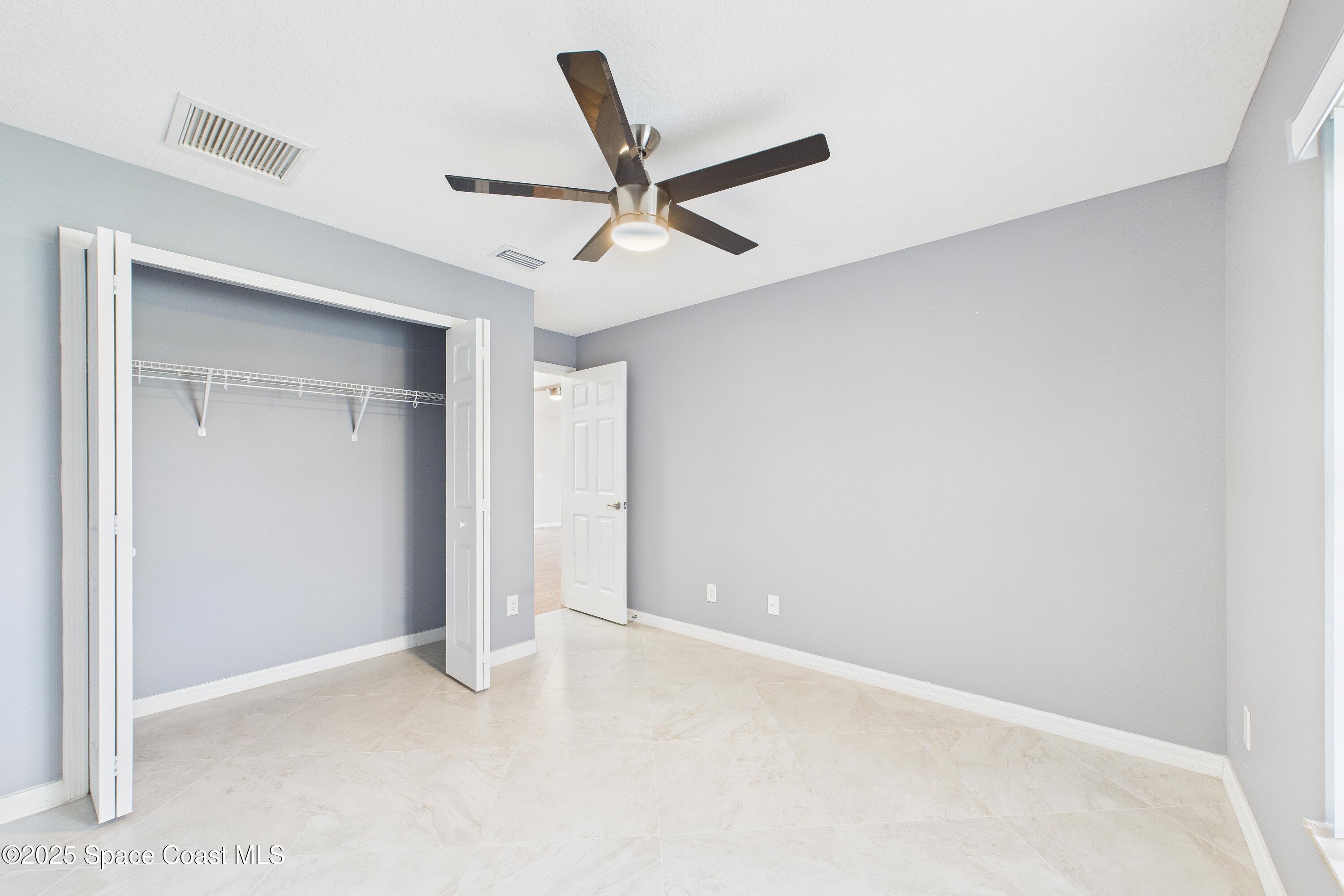 1936 Gloria Circle Palm Bay, FL 32905 - Photo 24 of 50 a view of an empty room