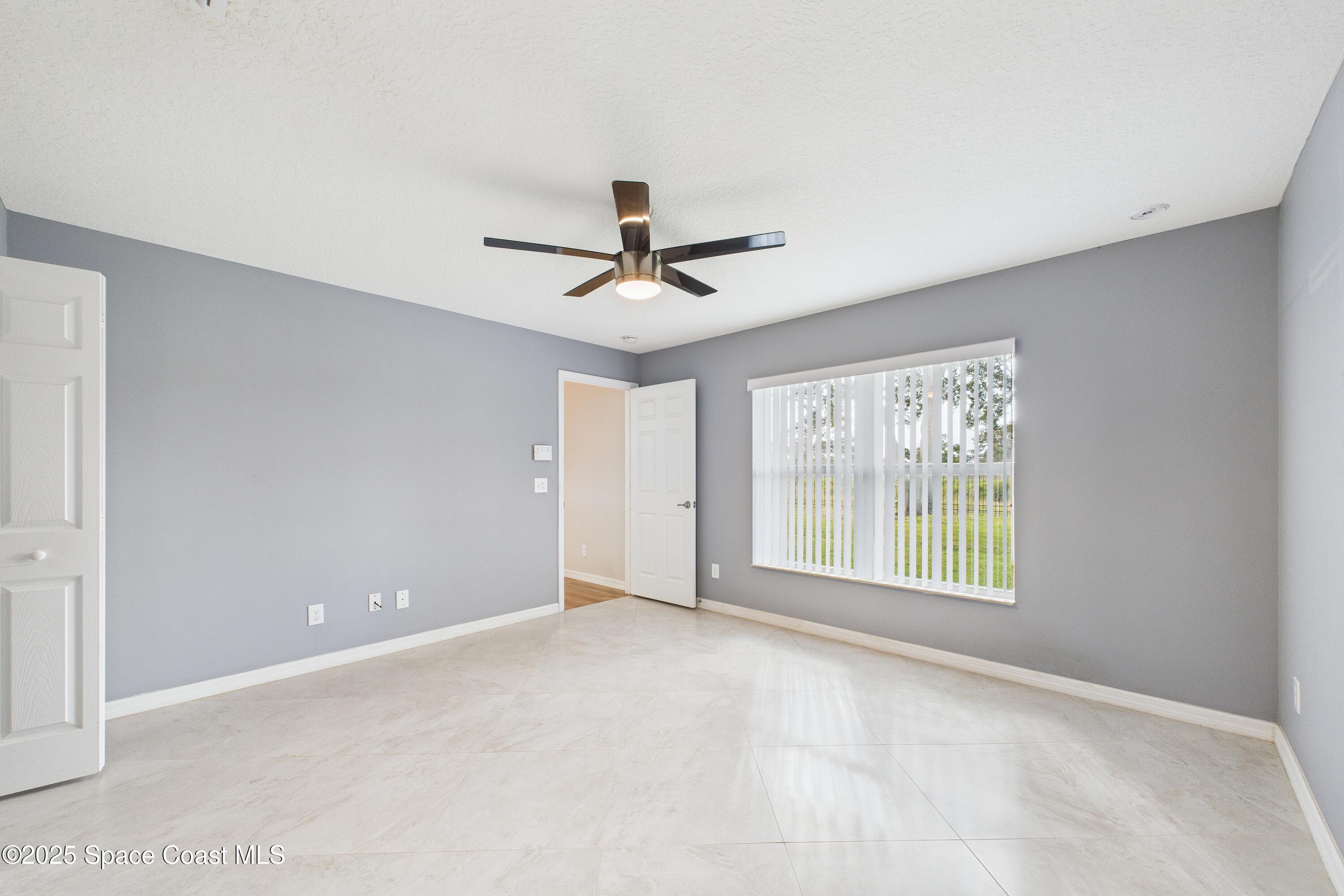 1936 Gloria Circle Palm Bay, FL 32905 - Photo 28 of 50 a view of an empty room with a window