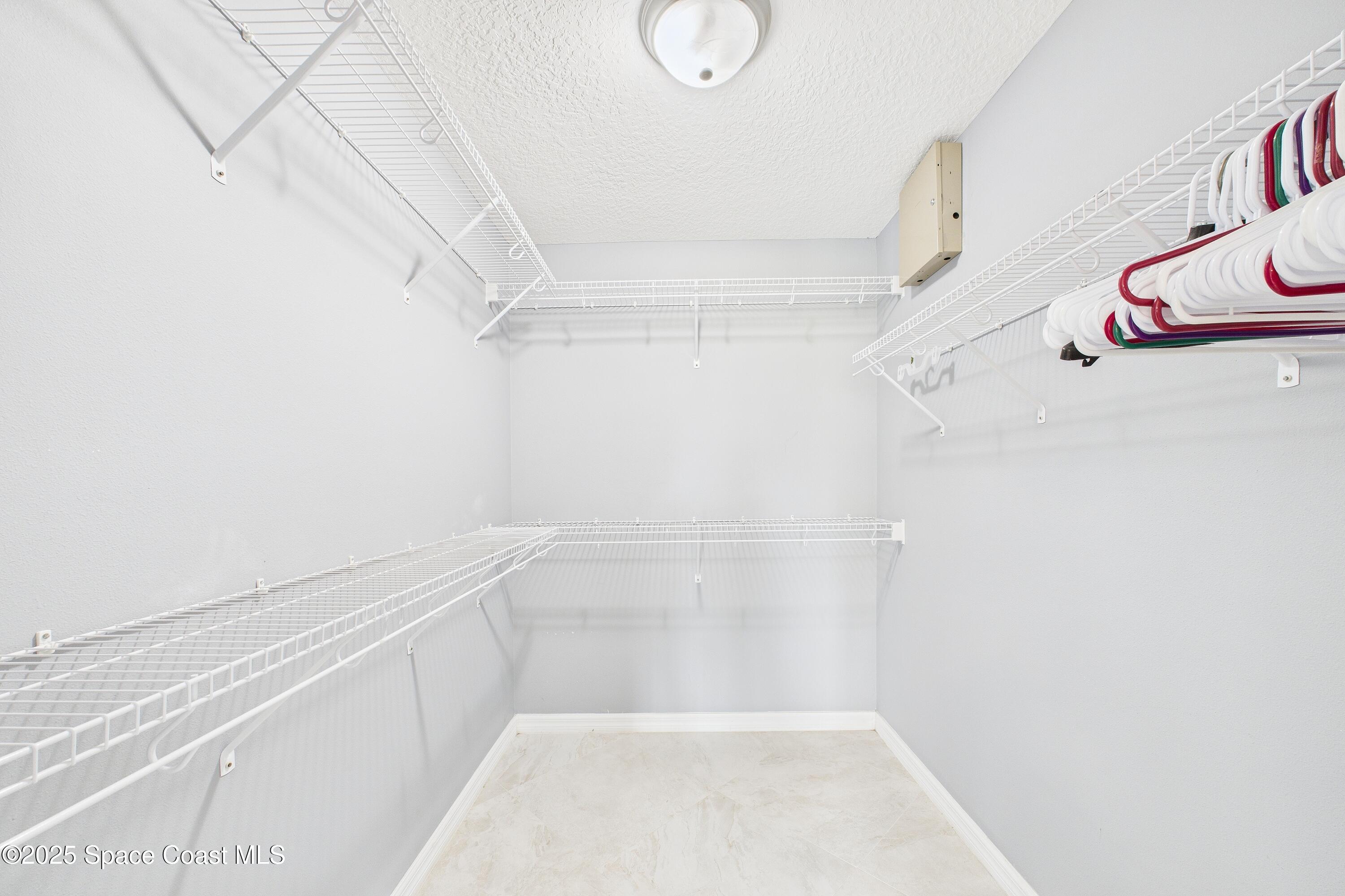 1936 Gloria Circle Palm Bay, FL 32905 - Photo 33 of 50 a view of a room with racks on the wall