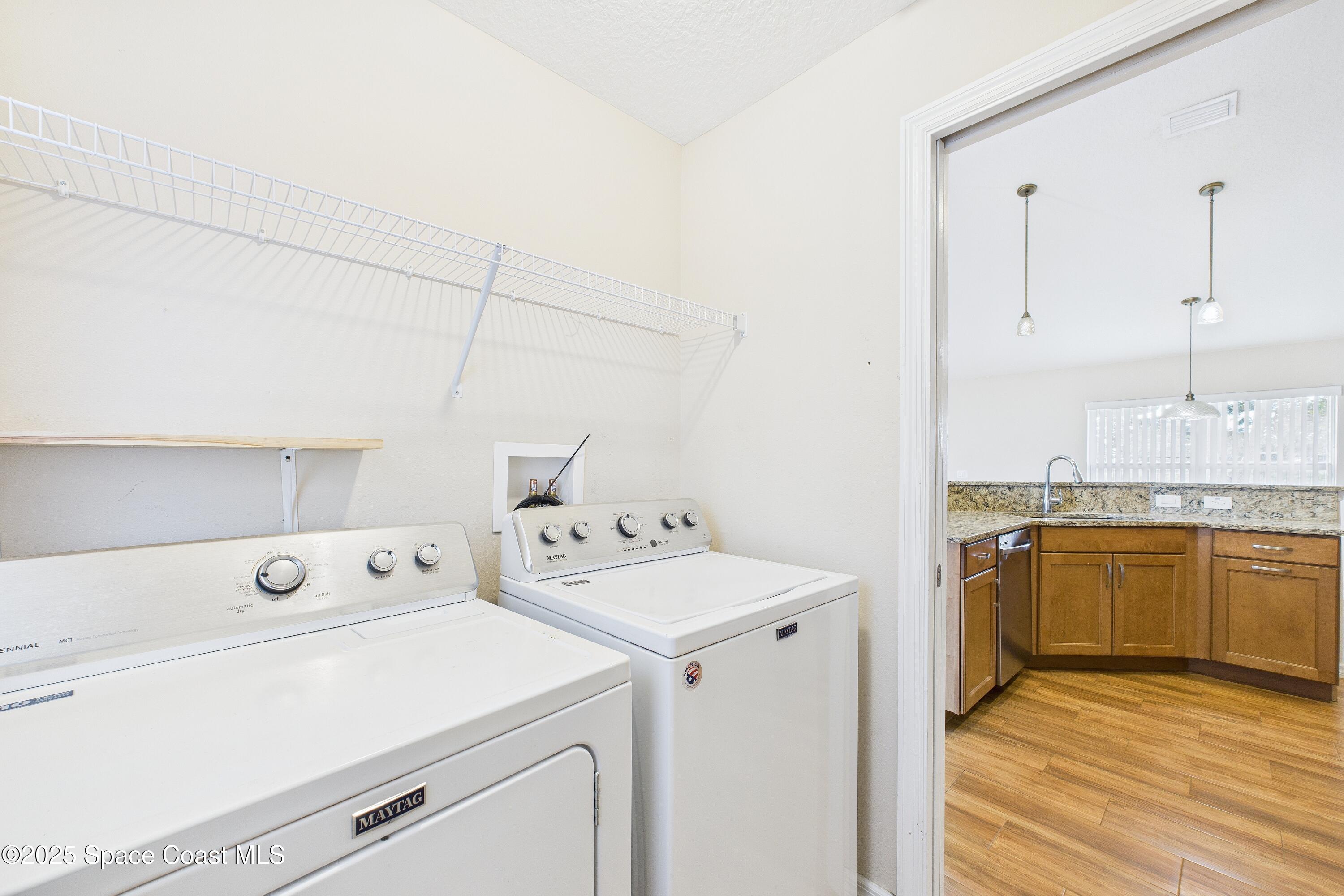 1936 Gloria Circle Palm Bay, FL 32905 - Photo 36 of 50 a utility room with dryer and washer