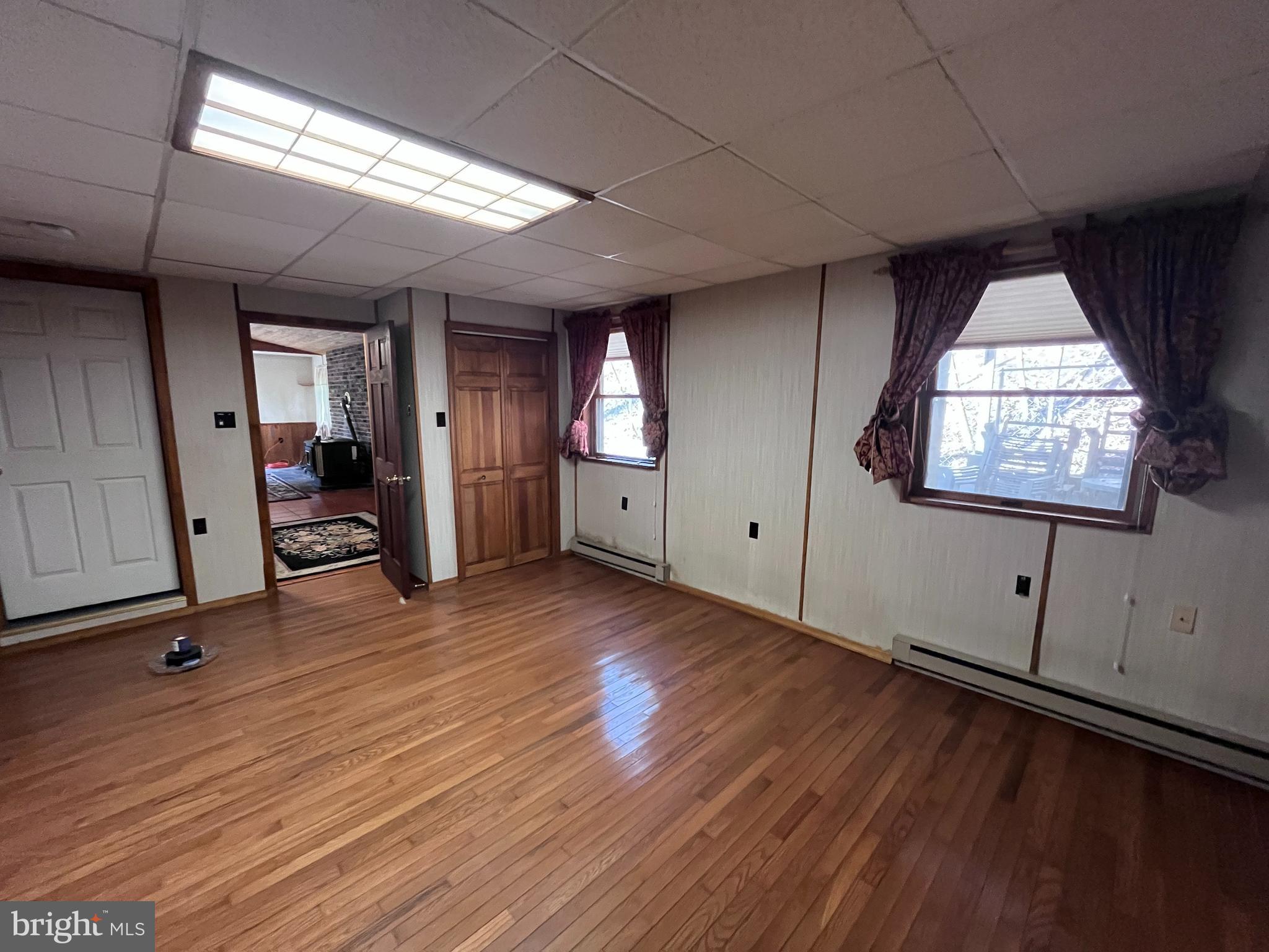 1343 Houser Road Fayetteville, PA 17222 - Photo 35 of 58 an empty room with wooden floor and windows