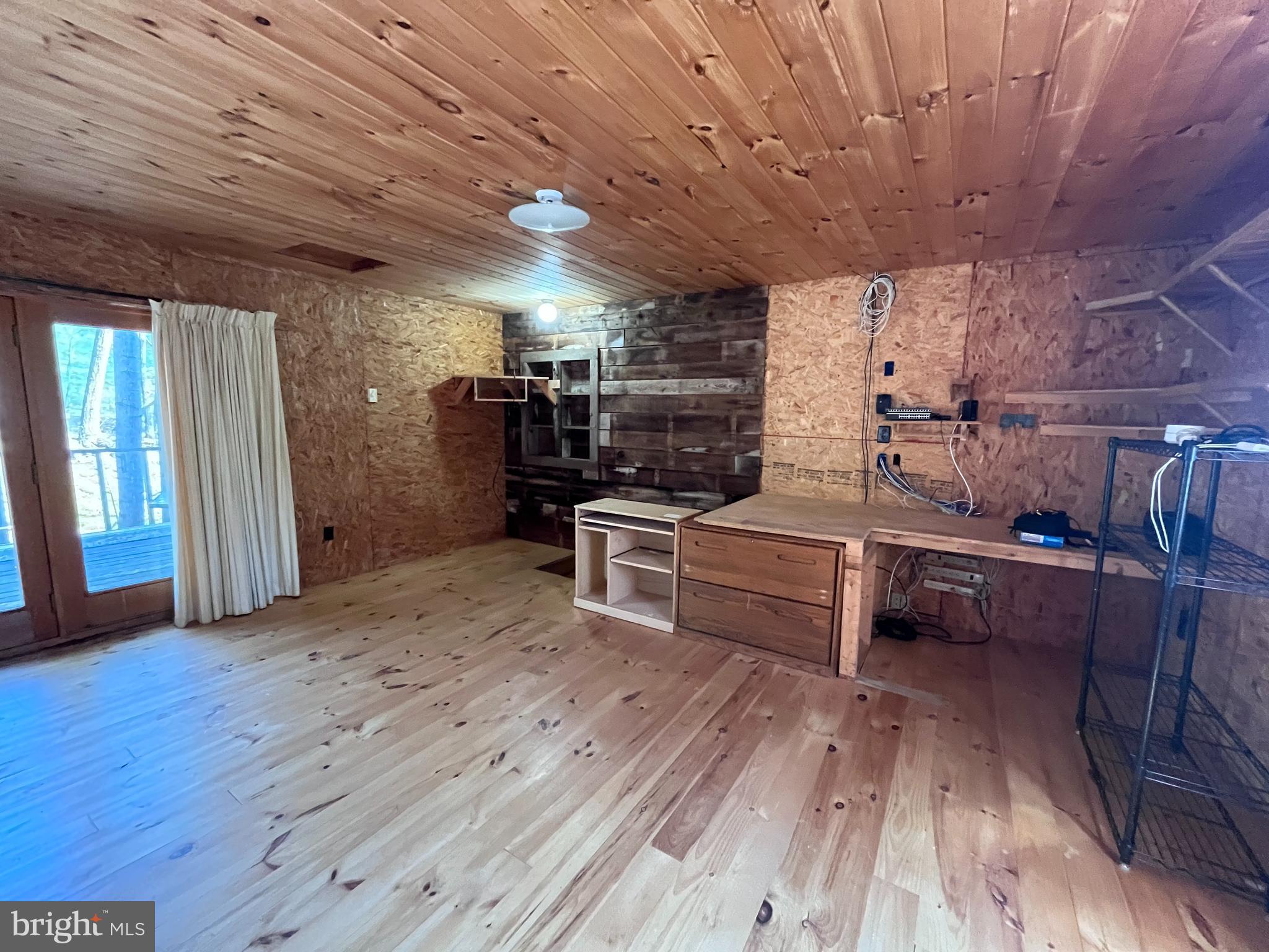 1343 Houser Road Fayetteville, PA 17222 - Photo 39 of 58 a kitchen with stainless steel appliances wooden floors stove and white cabinets