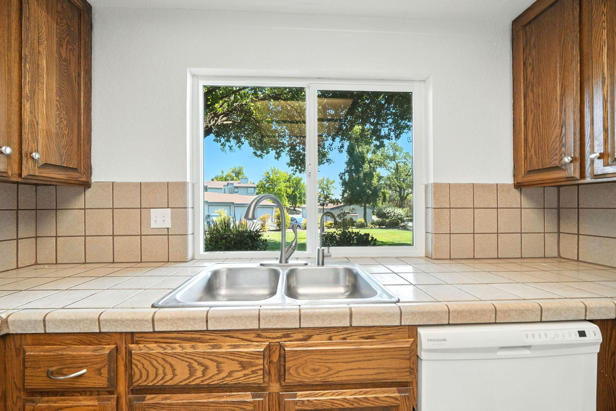 488 Ridgecrest Trail, Unit 133 Redding, CA 96003 - Photo 13 of 30 a kitchen with a sink and large window