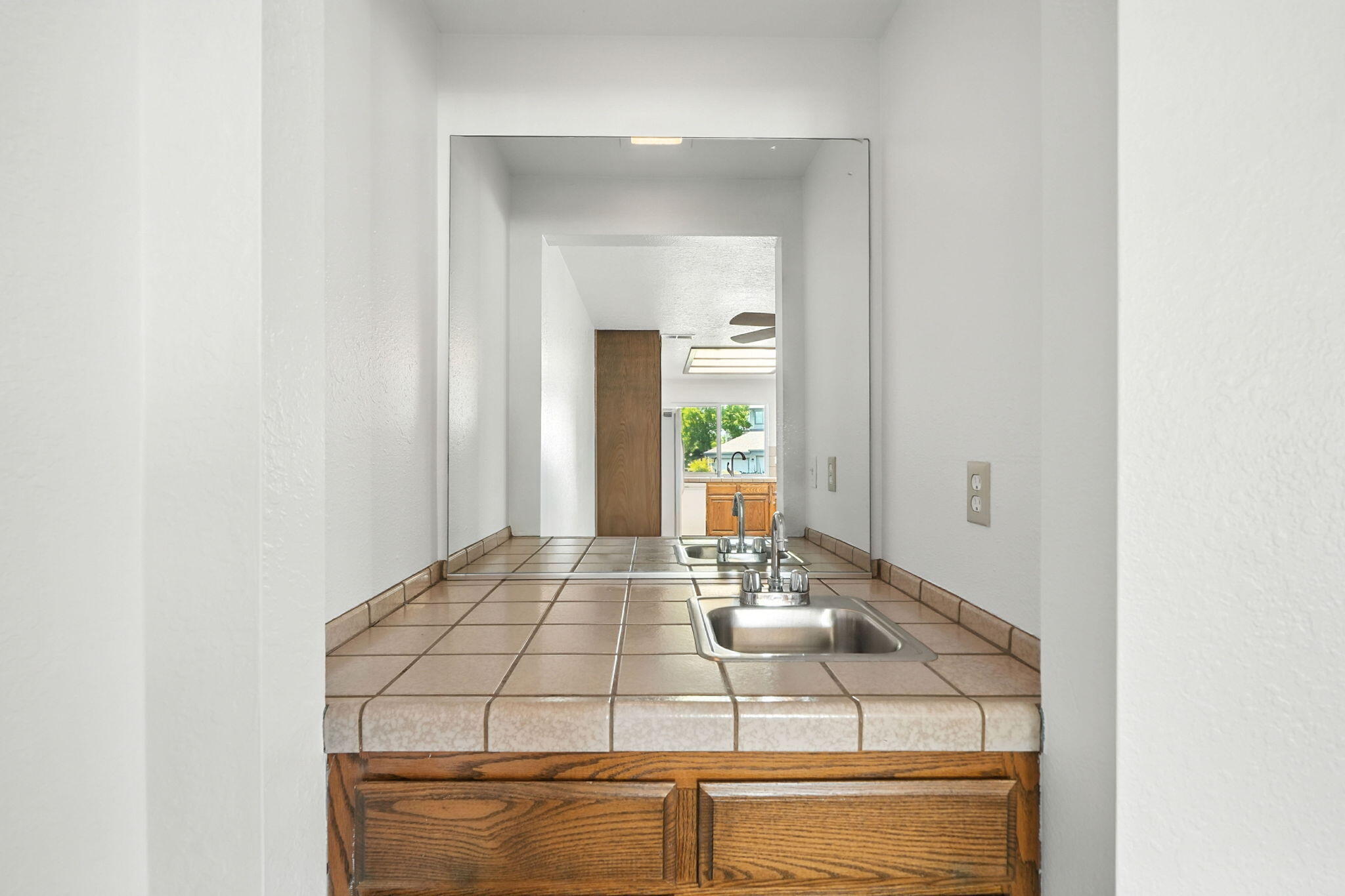 488 Ridgecrest Trail, Unit 133 Redding, CA 96003 - Photo 16 of 30 a bathroom with a sink and a mirror