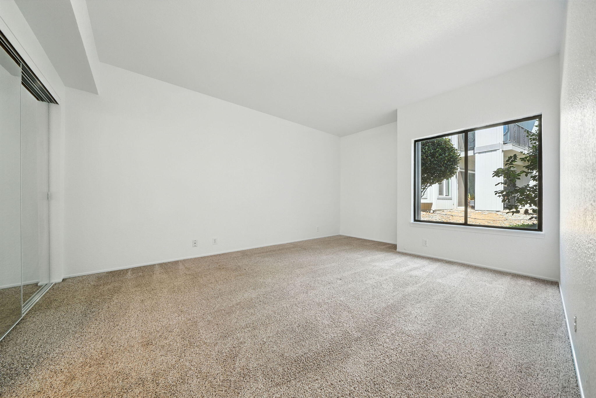 488 Ridgecrest Trail, Unit 133 Redding, CA 96003 - Photo 17 of 30 an empty room with windows and closet