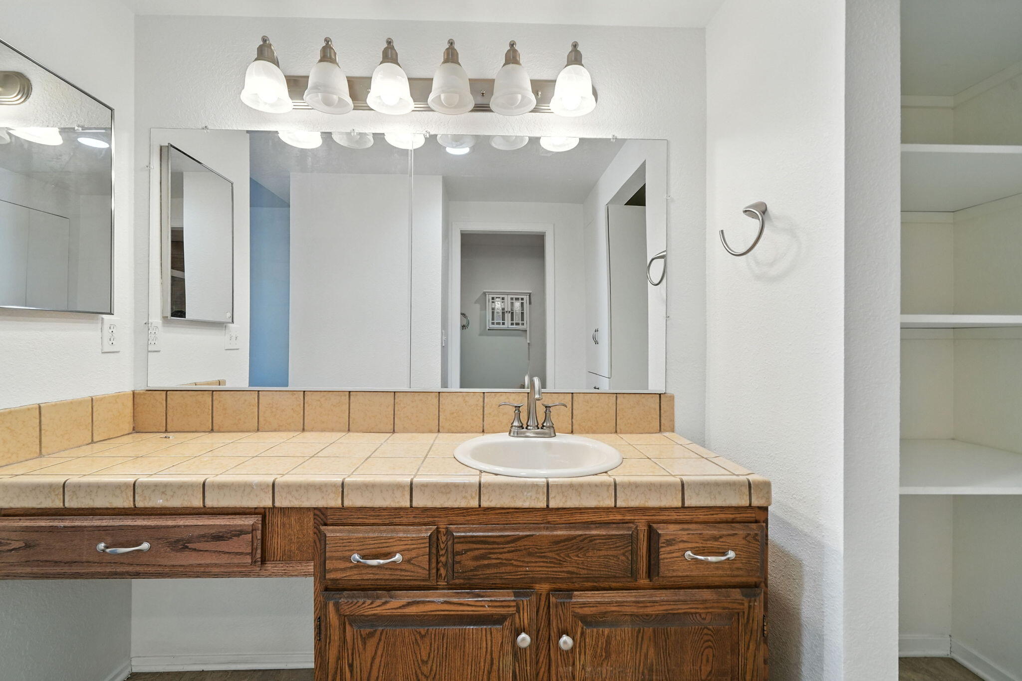 488 Ridgecrest Trail, Unit 133 Redding, CA 96003 - Photo 19 of 30 a bathroom with a sink and a mirror