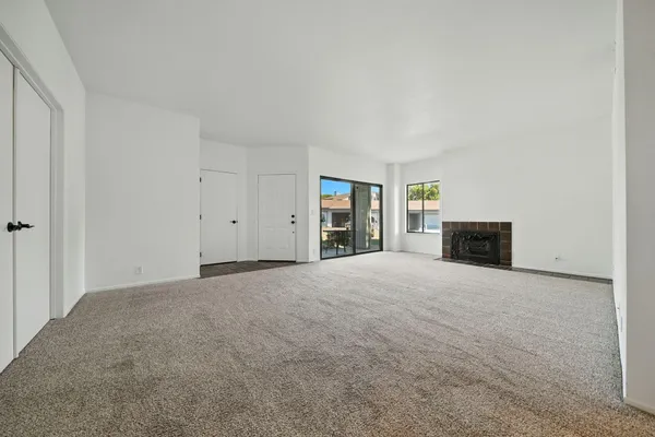 a view of an empty room with a balcony