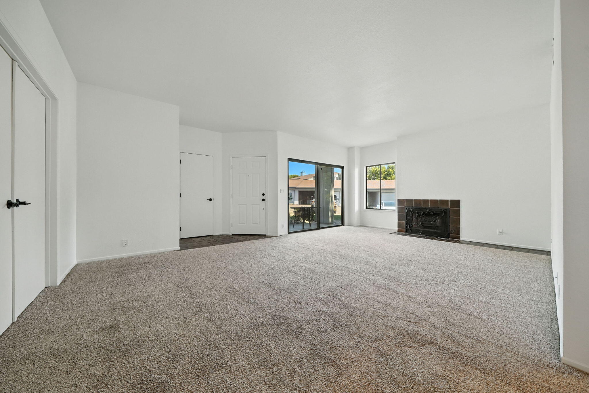 488 Ridgecrest Trail, Unit 133 Redding, CA 96003 - Photo 7 of 30 a view of an empty room with a fireplace and a window