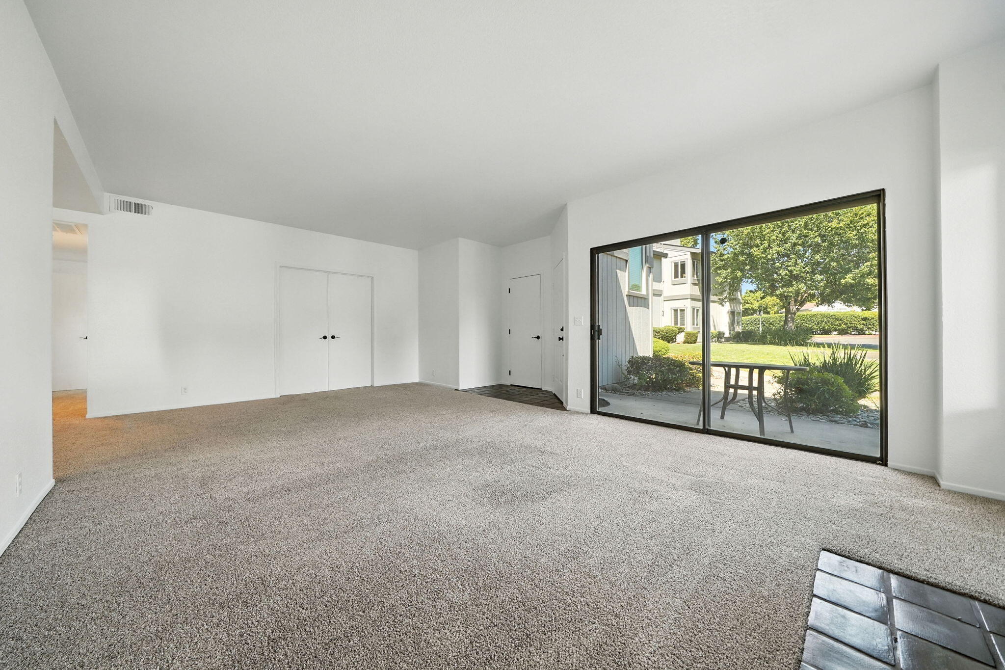 488 Ridgecrest Trail, Unit 133 Redding, CA 96003 - Photo 8 of 30 a view of an empty room with a balcony