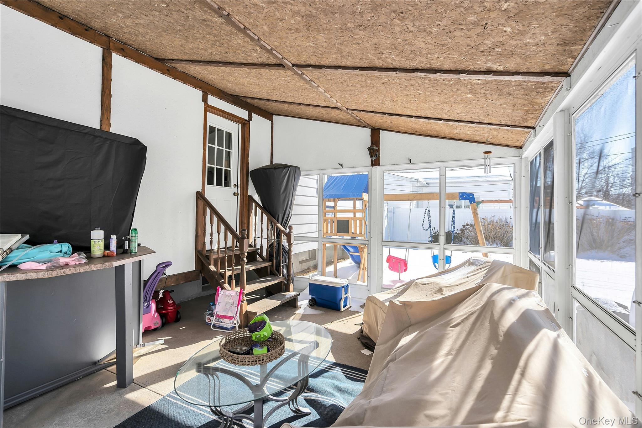 53 Calvert Avenue Commack, NY 11725 - Photo 21 of 25 a living room with a couch and a table