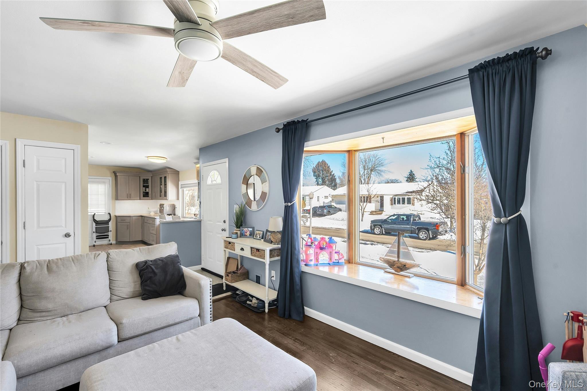 53 Calvert Avenue Commack, NY 11725 - Photo 7 of 25 a living room with furniture and a large window