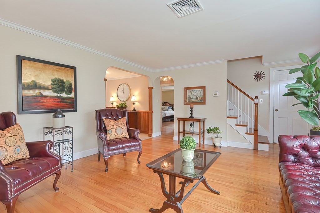 2 Woodfield Road Wellesley, MA 02482 - Photo 4 of 30 a living room with furniture and a wooden floor