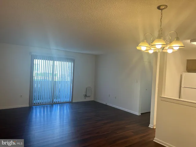 a view of a livingroom with wooden floor