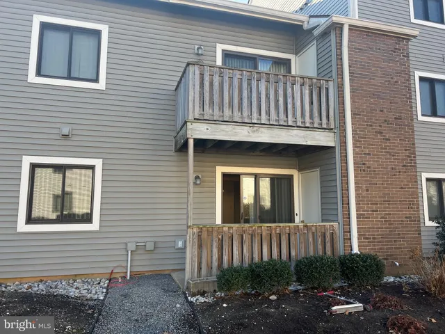 a view of a yard with a house in the background
