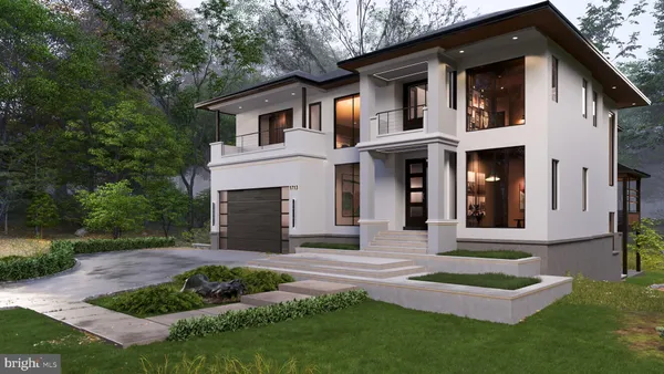 a front view of a house with a yard and trees