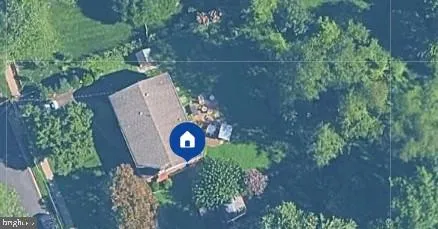 an aerial view of a backyard of a house