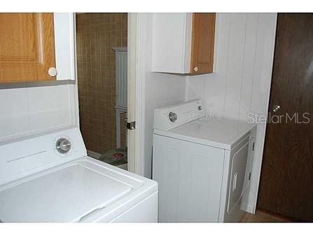 25624 Madison Street Astatula, FL 34705 - Photo 18 of 20 a utility room with dryer and washer