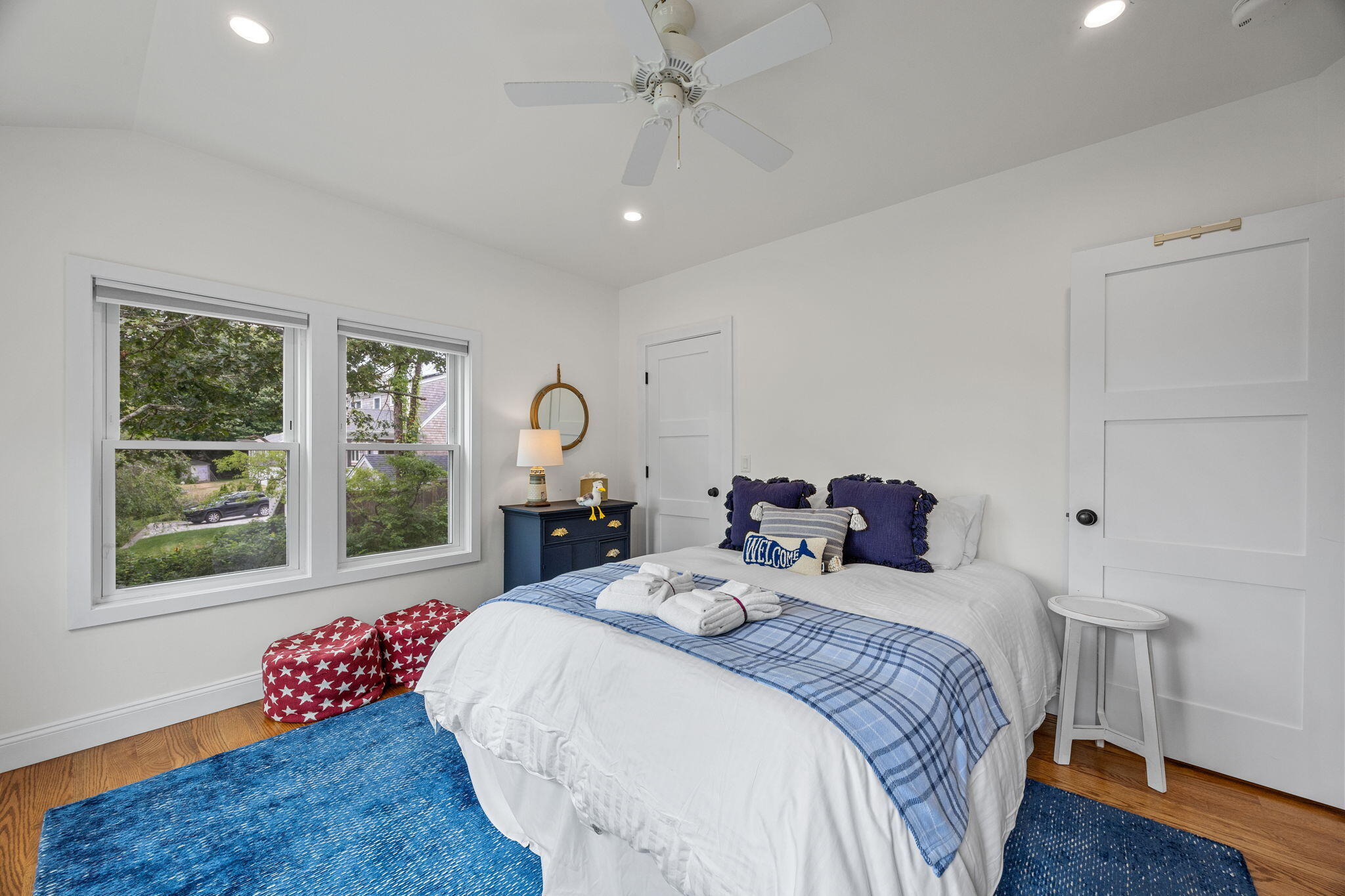 93 Orleans Road Chatham, MA 02633 - Photo 26 of 48 a spacious bedroom with a bed and a large window