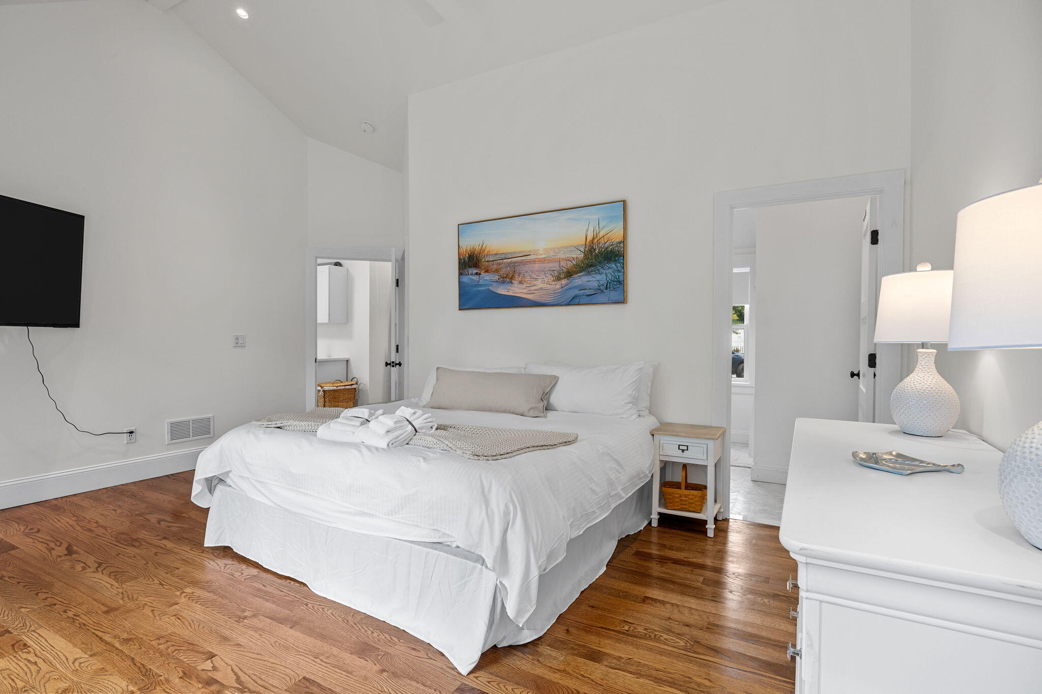 93 Orleans Road Chatham, MA 02633 - Photo 30 of 48 a bedroom with a bed and a flat screen tv