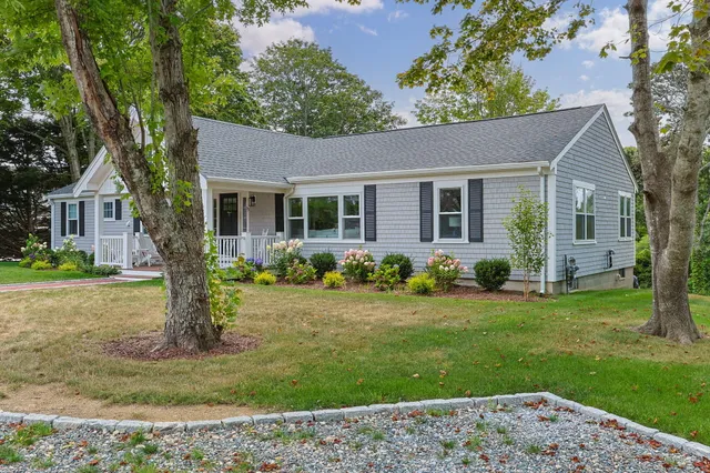 front view of a house with a yard