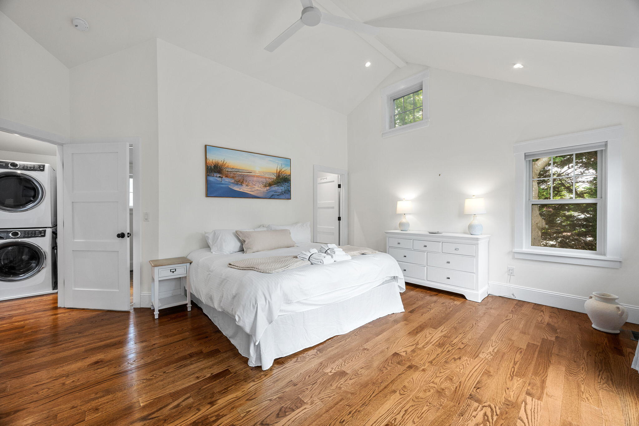 93 Orleans Road Chatham, MA 02633 - Photo 31 of 48 a spacious bedroom with a bed and a large window