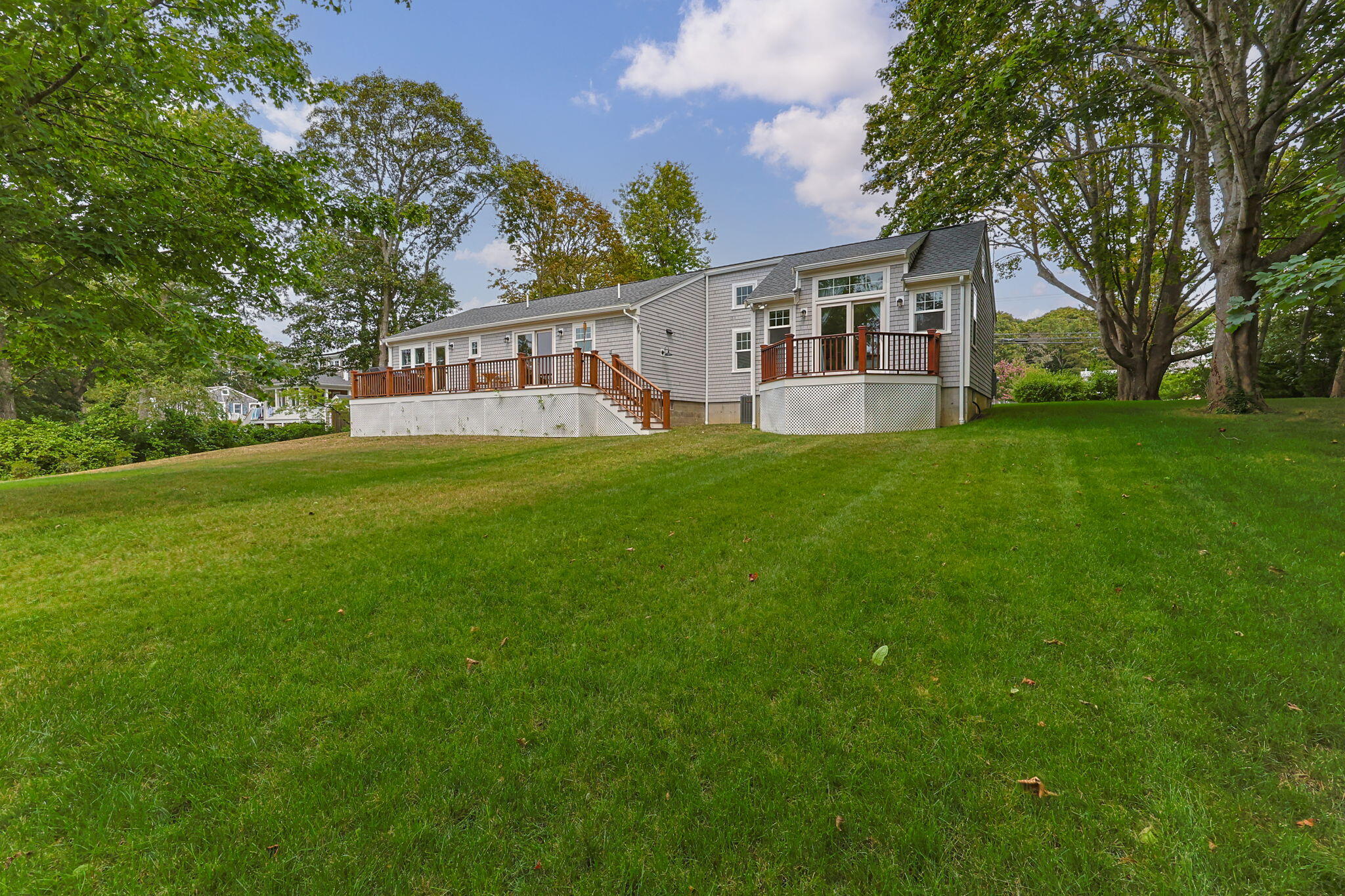 93 Orleans Road Chatham, MA 02633 - Photo 39 of 48 a view of a house with a yard