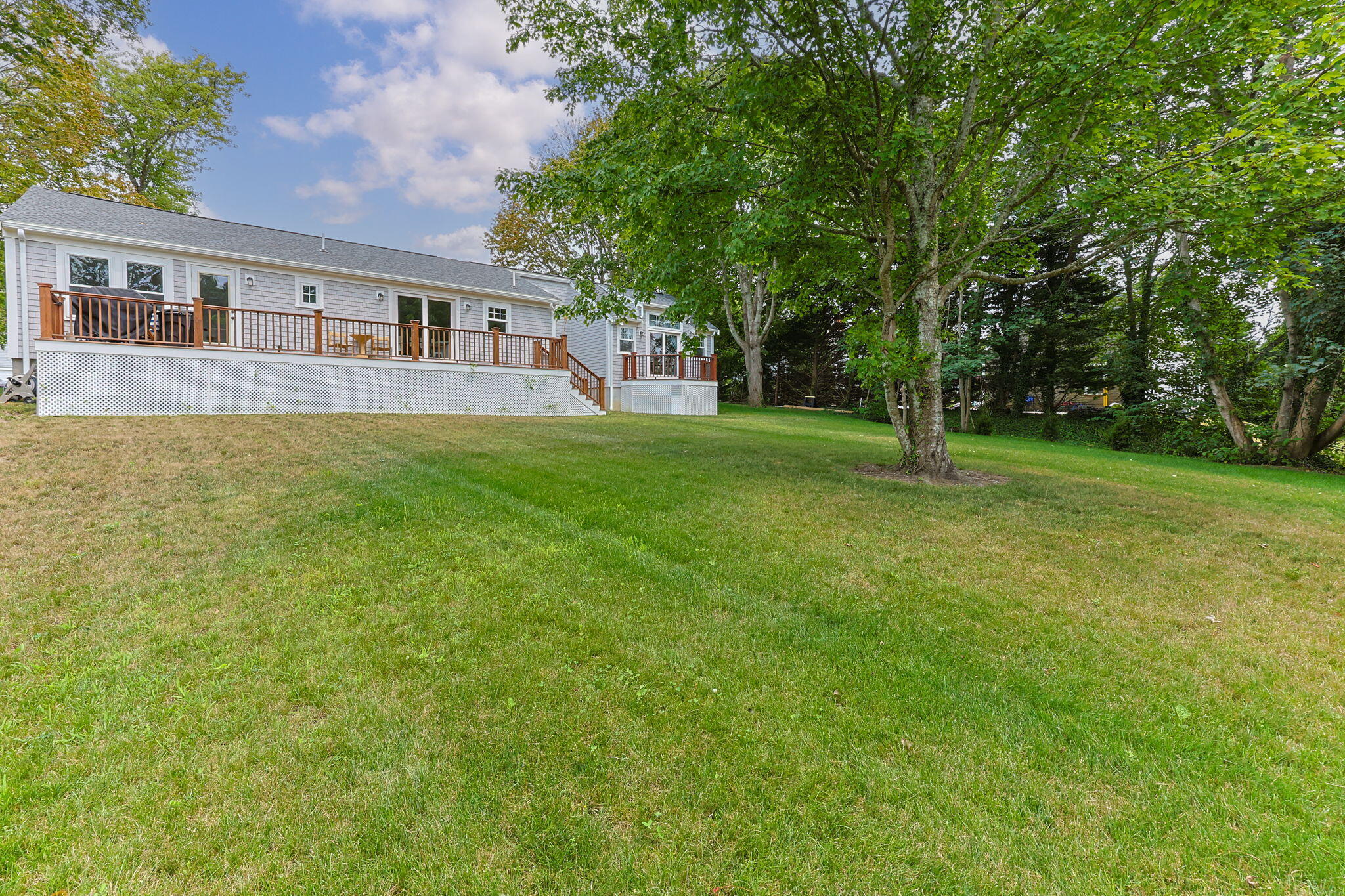 93 Orleans Road Chatham, MA 02633 - Photo 40 of 48 a view of a house with a backyard