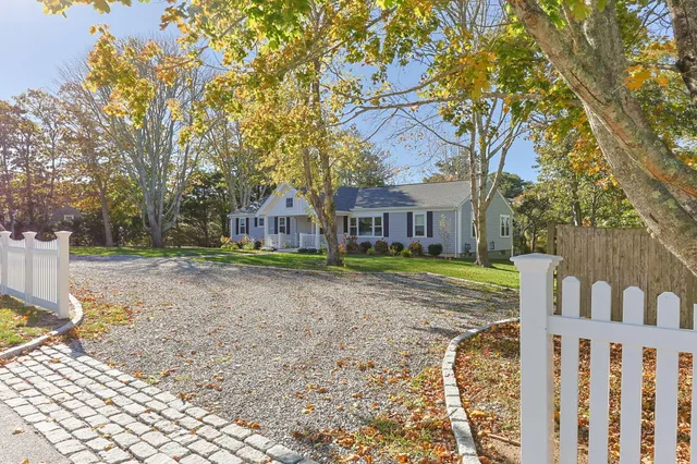 a house with trees in front of it
