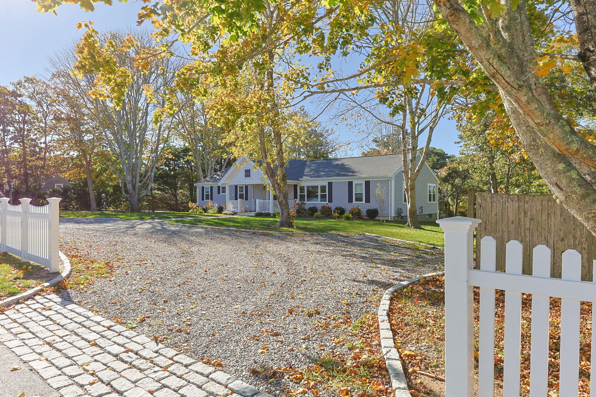 93 Orleans Road Chatham, MA 02633 - Photo 41 of 48 a house with trees in front of it