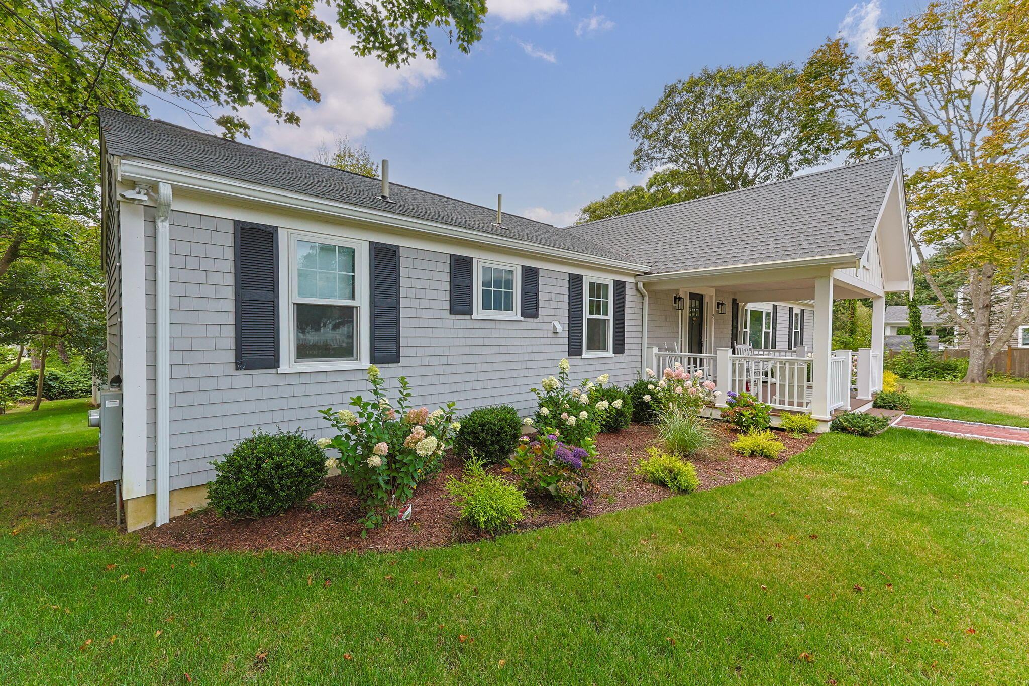 93 Orleans Road Chatham, MA 02633 - Photo 5 of 48 a front view of a house with a yard