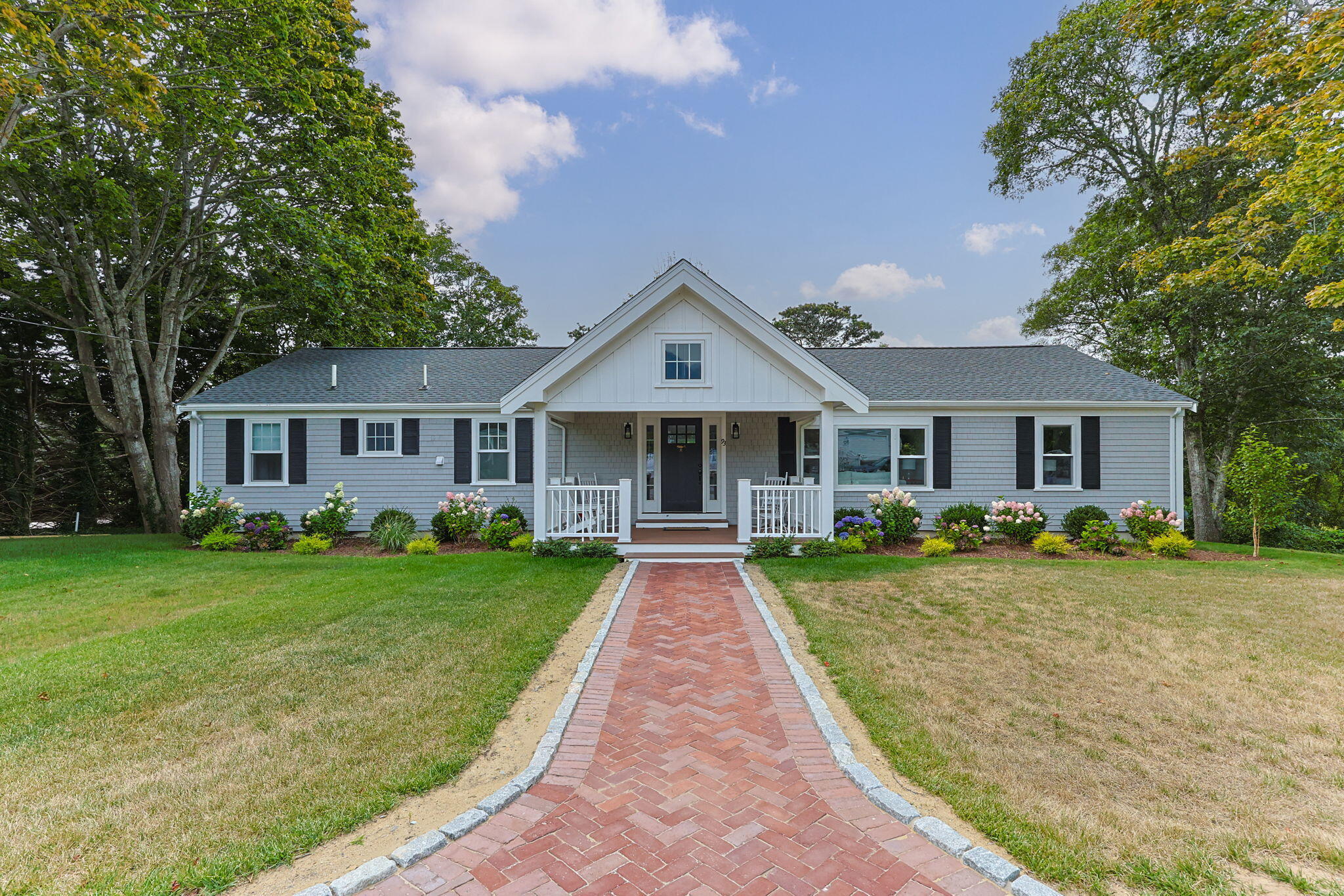 93 Orleans Road Chatham, MA 02633 - Photo 6 of 48 a front view of a house with a yard and porch