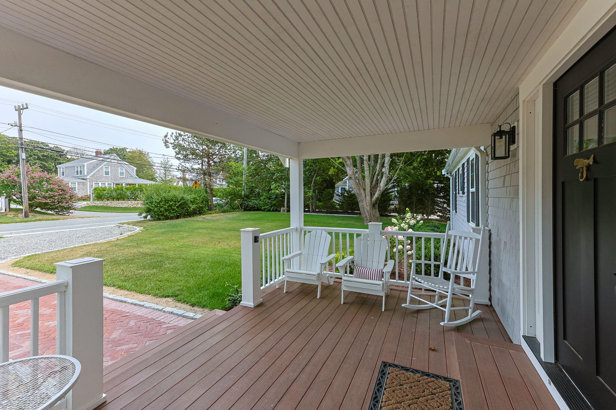 93 Orleans Road Chatham, MA 02633 - Photo 7 of 48 a deck view with a garden space and patio