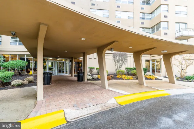 a swimming pool with an outdoor seating and yard