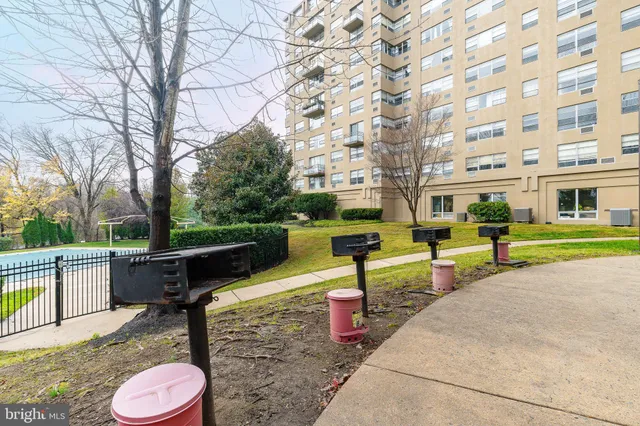 a view of outdoor space with swimming pool and sitting area