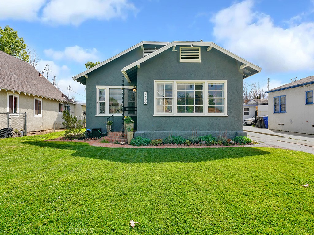 2750 Lime Street Riverside, CA 92501 - Photo 1 of 1 a front view of a house with a yard and porch
