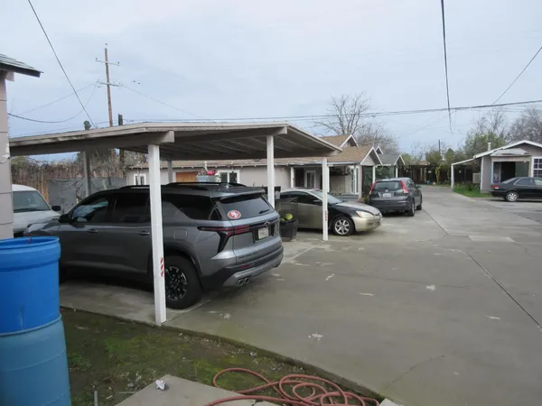 a view of a car park in front of house