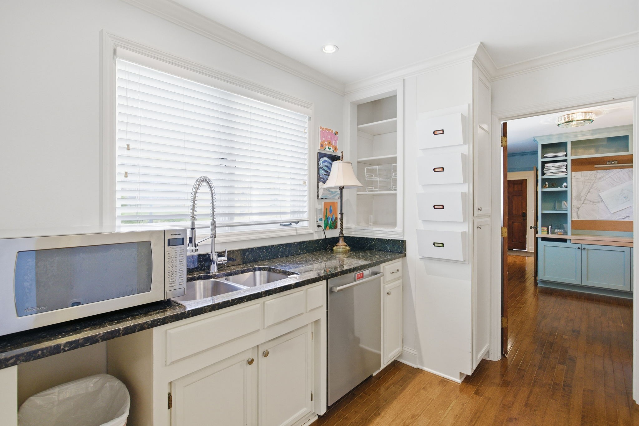 714 Farrell Road Nashville, TN 37220 - Photo 18 of 66 a kitchen with granite countertop white cabinets and wooden floor