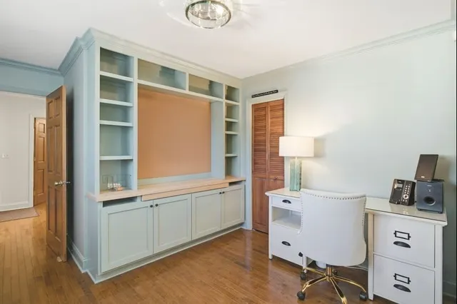 a bedroom with a bed and a table