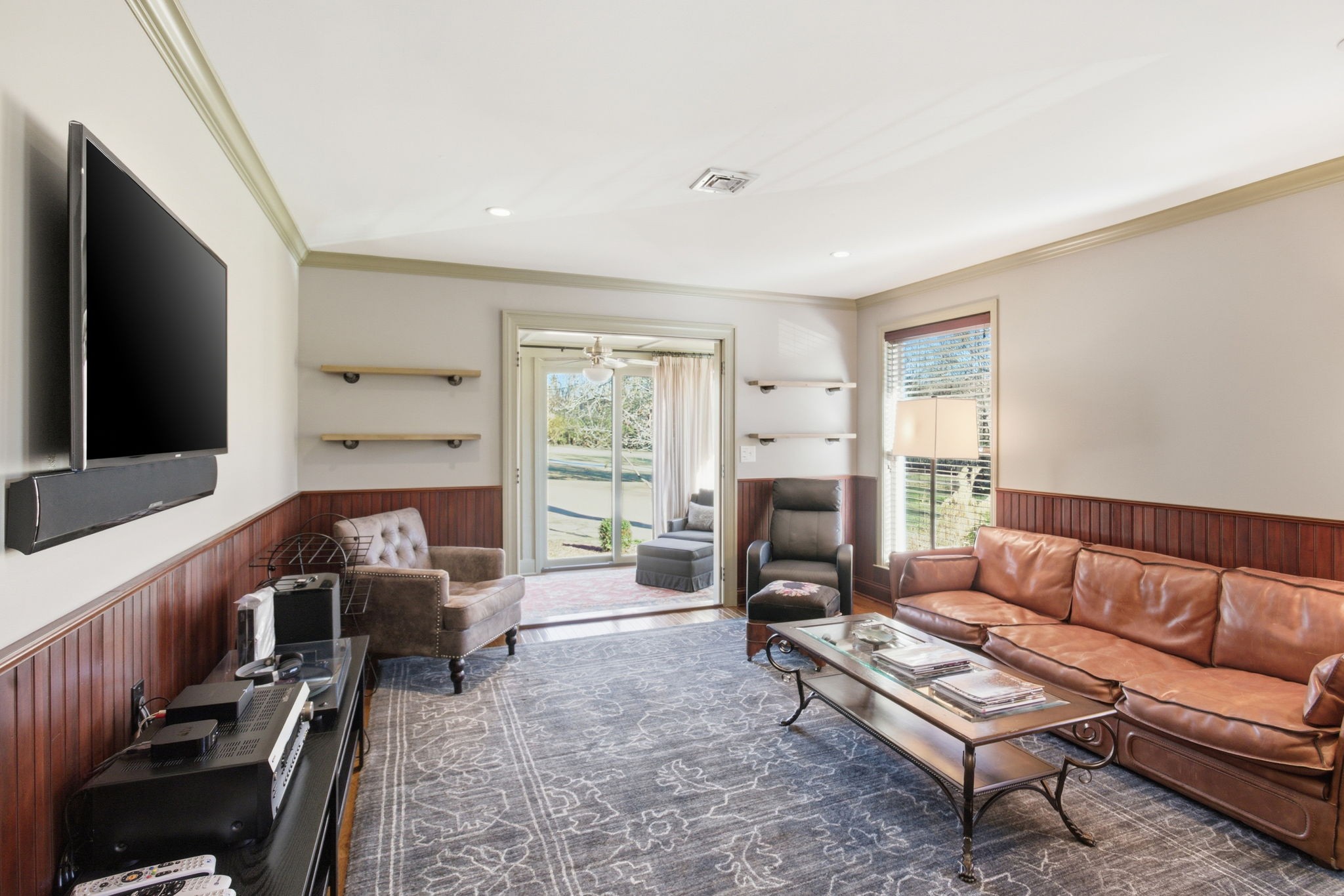 714 Farrell Road Nashville, TN 37220 - Photo 28 of 66 a living room with furniture a flat screen tv and a large window