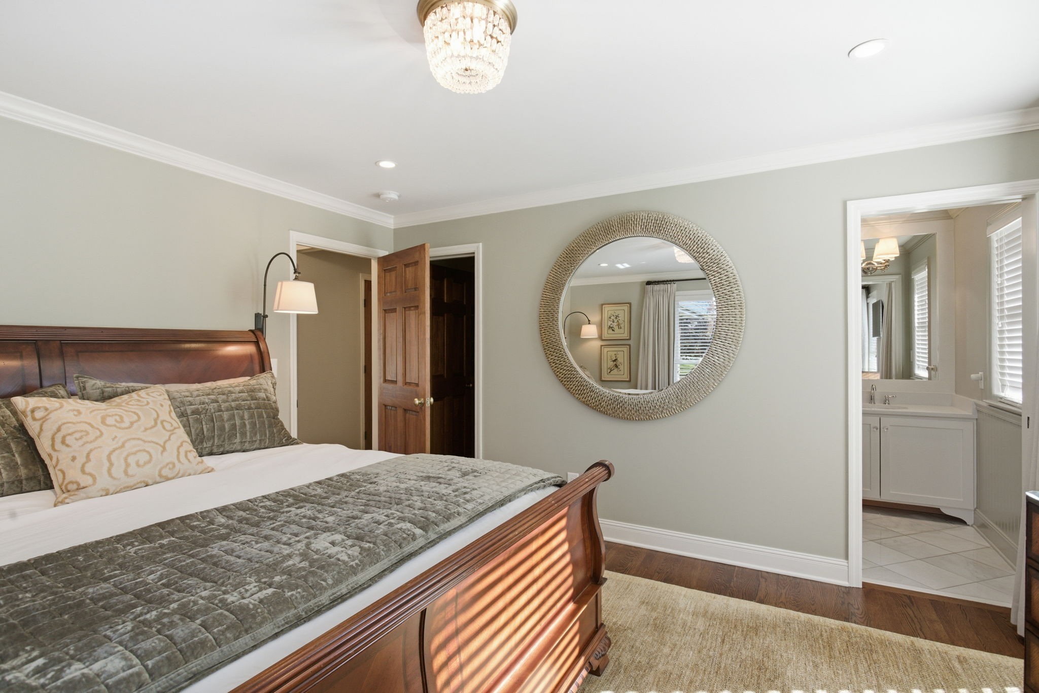 714 Farrell Road Nashville, TN 37220 - Photo 41 of 66 a bedroom with a large bed and a chandelier