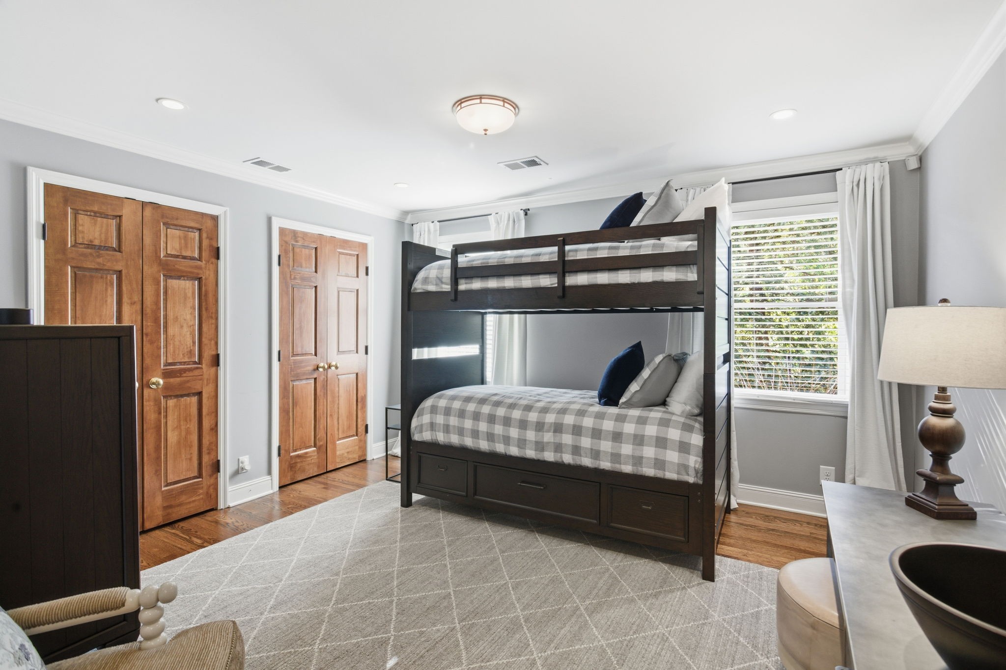 714 Farrell Road Nashville, TN 37220 - Photo 45 of 66 a bedroom with a bed and a dresser with wooden floor