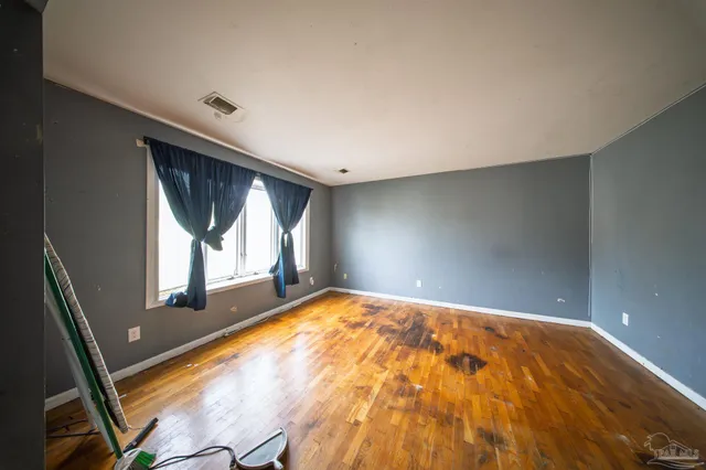 a view of an empty room and window